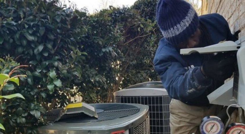 Technician Repairing AC Unit