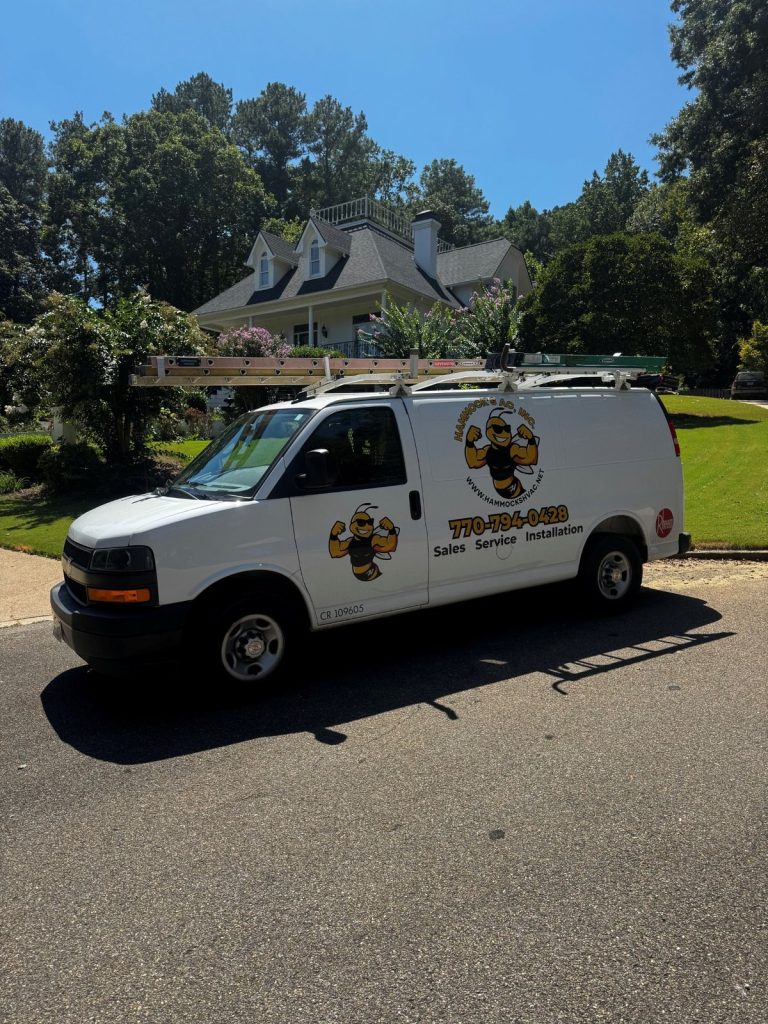 Hammocks AC service van at a residential HVAC service call
